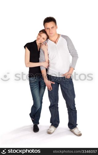 Casual loving couple posing together on white isolated background