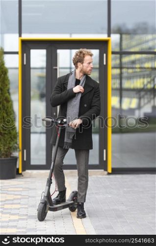 casual male posing with electric scooter 11