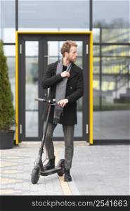 casual male posing with electric scooter 11