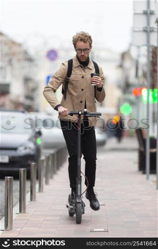 casual male posing with electric scooter 12