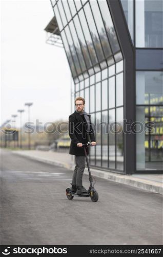 casual male posing with electric scooter 15