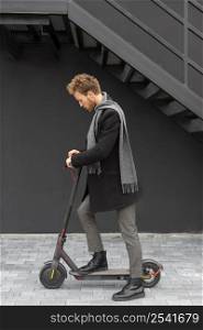 casual male posing with electric scooter 27