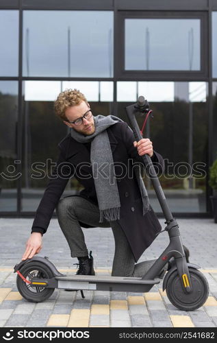 casual male posing with electric scooter 30