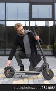 casual male posing with electric scooter 30