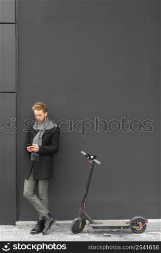 casual male posing with electric scooter 5