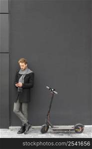 casual male posing with electric scooter 5
