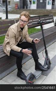 casual male posing with electric scooter 9