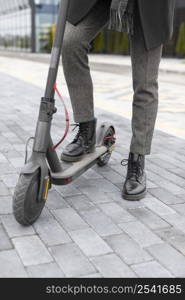 casual male posing with his electric scooter 2