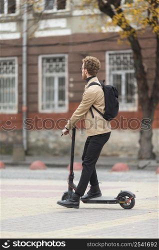 casual male riding electric scooter 7