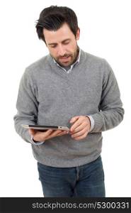 casual man looking to his tablet pc, isolated