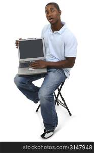 Casual Man with Laptop Computer and Shocked Expression on Face.