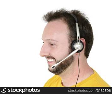 Casual man with phone headset wearing yellow t-shirt over white.