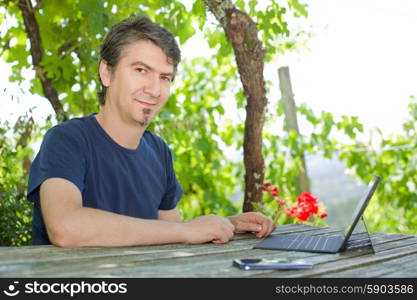 casual man working with a tablet pc, outdoor