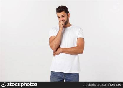 Casual portrait of happy university student guy standing with arms folded, laughing.. Casual portrait of happy university student guy standing with arms folded, laughing