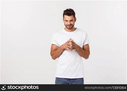 Casual portrait of happy university student guy standing with arms folded, laughing.. Casual portrait of happy university student guy standing with arms folded, laughing