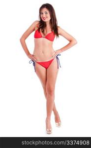 Casual pose of sexy young woman in red bikini against white background