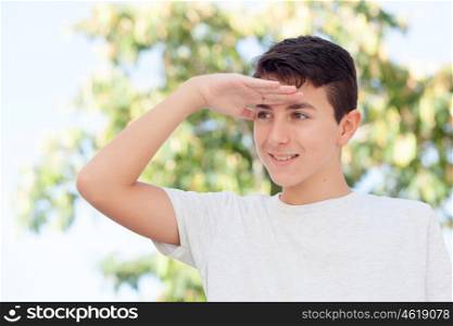 Casual teenager boy looking something outdoor