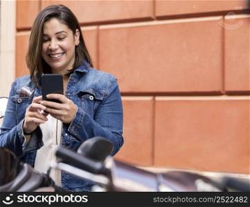 casual teenager browsing her phone
