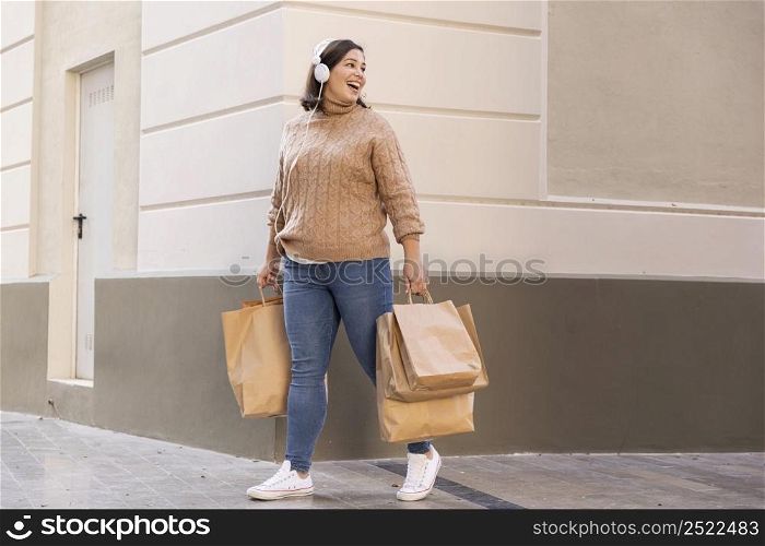 casual teenager carrying shopping bags 2