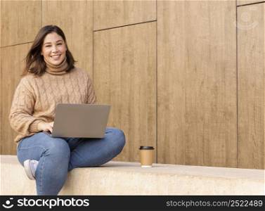 casual teenager holding her laptop 3
