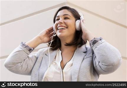 casual teenager listening music outdoors 2