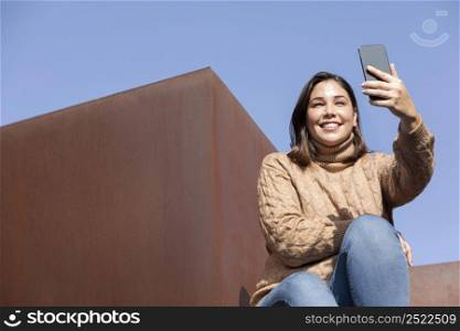 casual teenager taking selfie