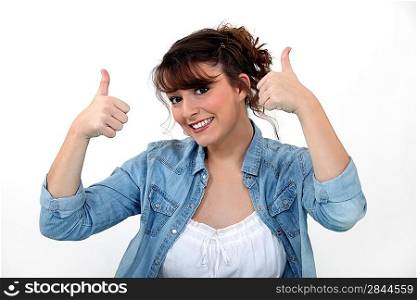 Casual woman with both thumbs up.