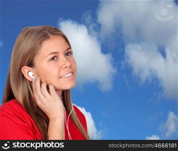 Casual Young Girl Listening Music With the blue sky of background