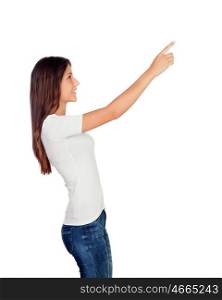 Casual young girl pointing something at side isolated on a white background