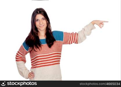 Casual young girl pointing something isolated on a white background