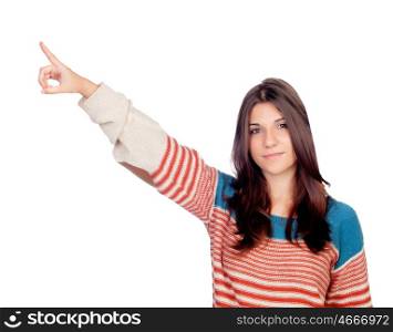 Casual young girl pointing something isolated on a white background