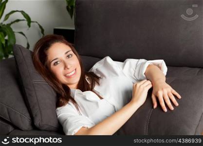 Casual young girl relaxing on couch at home&#xA;&#xA;
