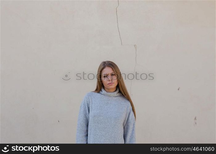 Casual young girl with a cracked wall of background