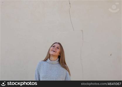 Casual young girl with a cracked wall of background