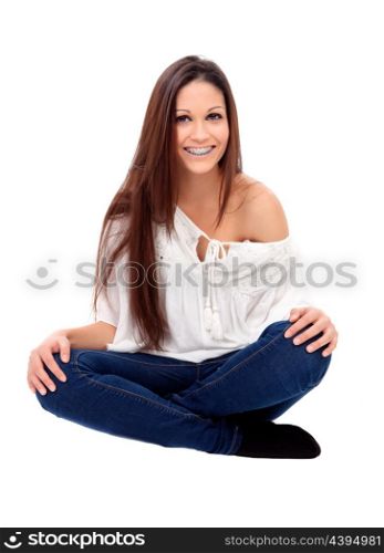 Casual young girl with brackets sitting isolated on a white background