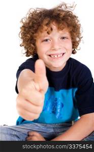 Casual young kid showing thumbs up and smiling at camera.