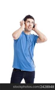 Casual young man listening music with headphones, isolated on white background