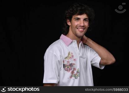 Casual young man portrait isolated on black background