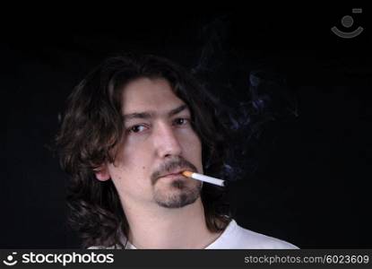 casual young man portrait posing with cigarette
