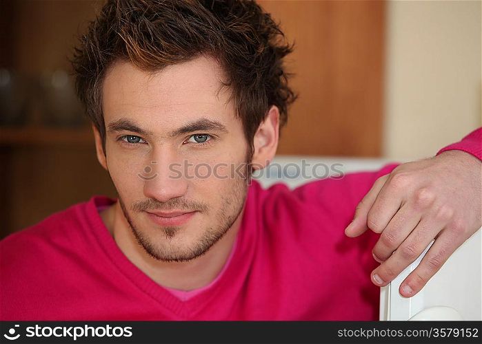 Casual young man relaxing at home