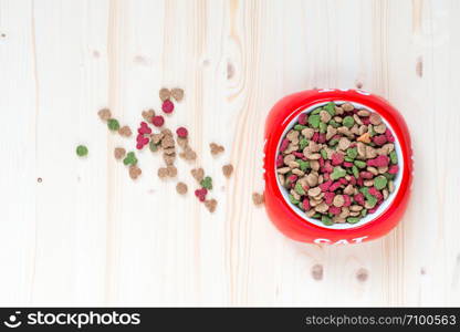 cat bowl with dry food top view close-up