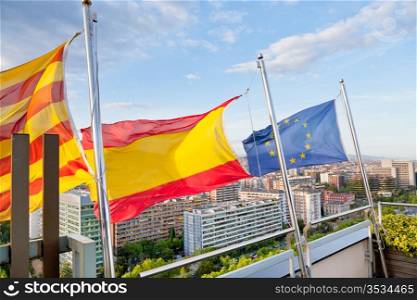 Catalan, Spanish, EU flags under Barcelona city