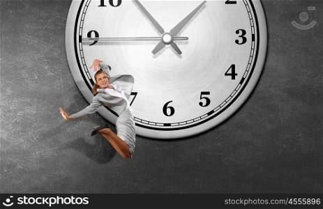 Catch up with time. Concept of time with funny businesswoman running in a hurry