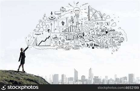Catch your success idea. Young businesswoman catch with hand sketched business plan