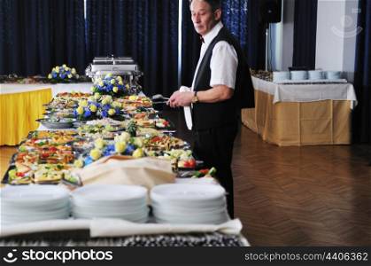 catering buffet food party preparation man