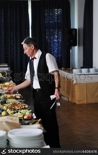 catering buffet food party preparation man