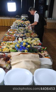 catering buffet food party preparation man