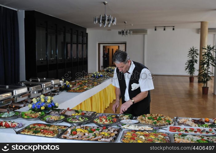 catering buffet food party preparation man