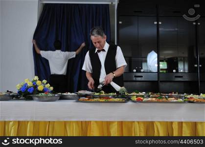 catering buffet food party preparation man