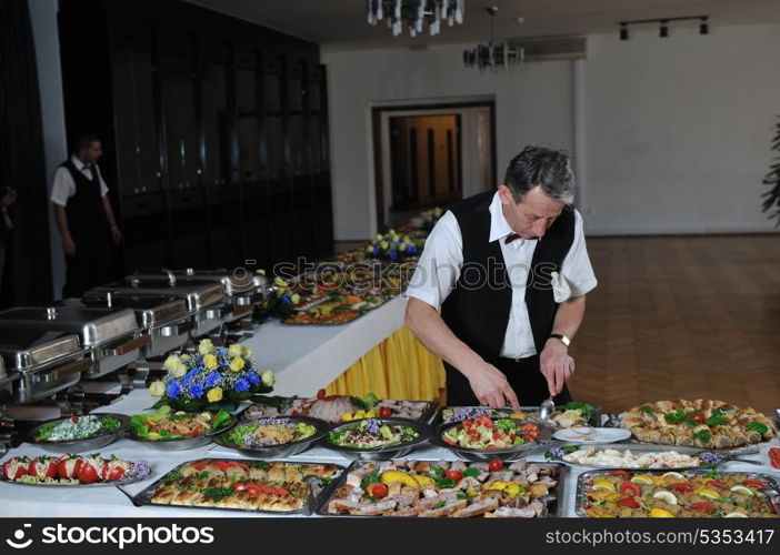 catering buffet food party preparation man